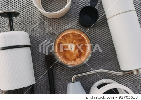 Espresso french press and coffee grinder equipments on grey background. Espresso french press and coffee grinder equipments on grey background. 92703618