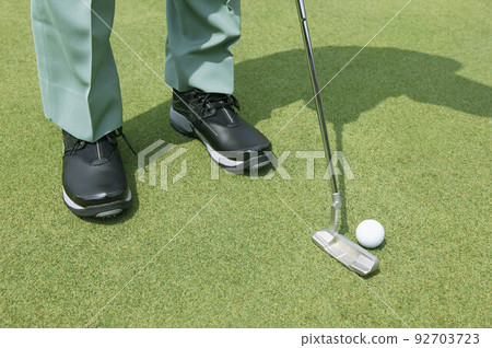 Golfer putting Golfer putting 92703723