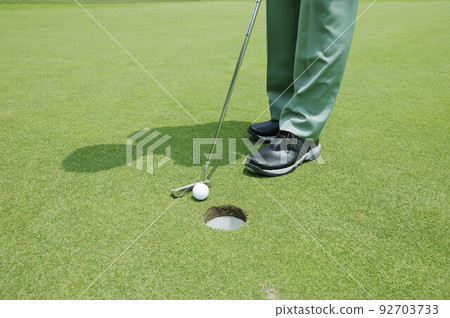 Golfer putting Golfer putting 92703733