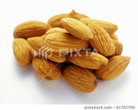 Almond macro isolated in white background Almond macro isolated in white background 92703790