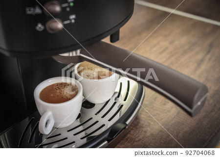 Coffee machine preparing fresh coffee 92704068