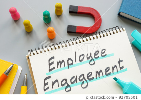 Phrase employee engagement near magnet and figurines. 92705501