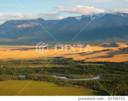 Amazing passes, the mountains and rocks of Altai. Autumn landscape in clear weather with winding river. Warm sunlight and open space, freedom. 92706725