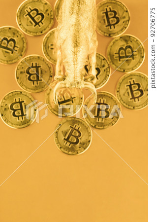 Bull walking over Bitcoins against golden background. Market uptrend concept. Bull walking over Bitcoins against golden background. Market uptrend concept. 92706775