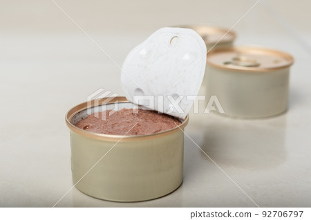 Pet food in the form of pate in an open tin. Pet food in the form of pate in an open tin. 92706797