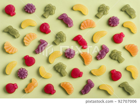 Jelly candies in shape of fruits, trees and birds as pattern Jelly candies in shape of fruits, trees and birds as pattern 92707006