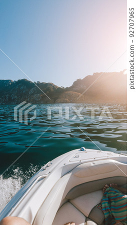 Bow of a boat facing an island Bow of a boat facing an island 92707965