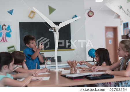 Elementary School Stem Robotics Classroom Diverse Group of Children Building and Programming windmill ecology robot concept. Together Talking and Working as a Team. Creative Robotics Engineering 92708264