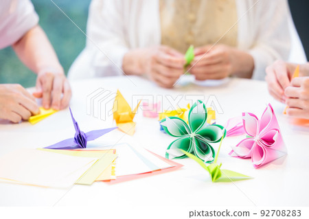 A senior woman folding origami and a caregiver Photography cooperation "LINK FOREST" A senior woman folding origami and a caregiver Photography cooperation "LINK FOREST" 92708283