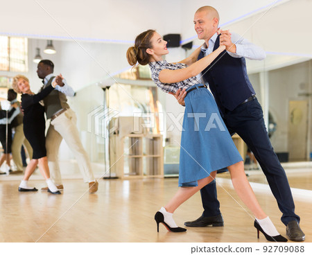 Man and woman learning to dance classical ballroom dance Man and woman learning to dance classical ballroom dance 92709088