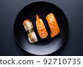 Close up of sashimi sushi set on black background. 92710735