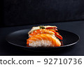 Japanese seafood sushi on black background. 92710736
