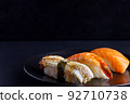 Japanese seafood on dark background. Sushi Set. 92710738
