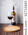 Red wine glasses and bottle on wooden background. 92710885