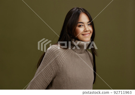 pretty woman in a sweater posing smile clothing fashion isolated background 92711963