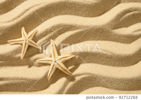 Sandy beach background with starfishes . Top view Sandy beach background with starfishes . Top view 92712268