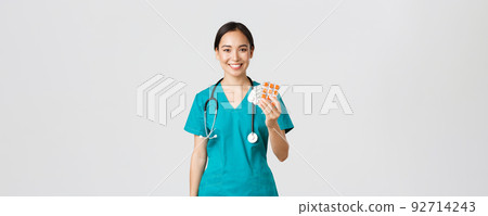 Healthcare workers, preventing virus, quarantine campaign concept. Friendly-looking female asian nurse, doctor explain patient medication prescription, showing drugs and smiling, white background 92714243