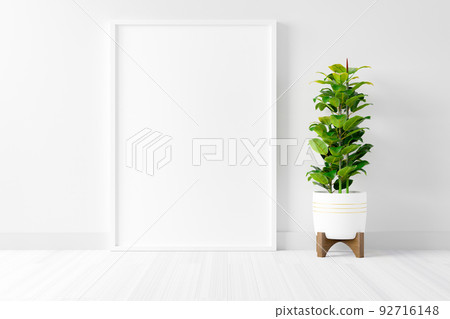 Blank empty picture frame mockup on white cement wall. Blank empty picture frame mockup on white cement wall. 92716148