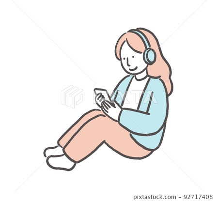 A woman listening to music while watching a smartphone 92717408