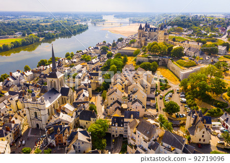View of Saumur with medieval fortified Chateau and parish church 92719096