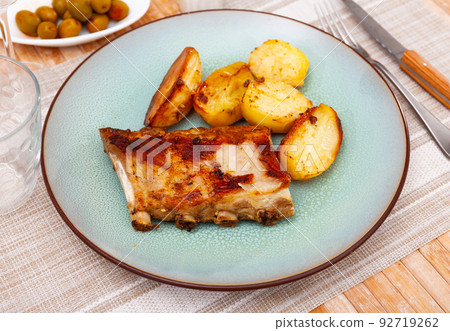 Roasted pork ribs with fried potatoes Roasted pork ribs with fried potatoes 92719262