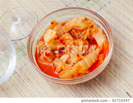 Korean spicy pickled napa cabbage kimchi in salad bowl 92719347