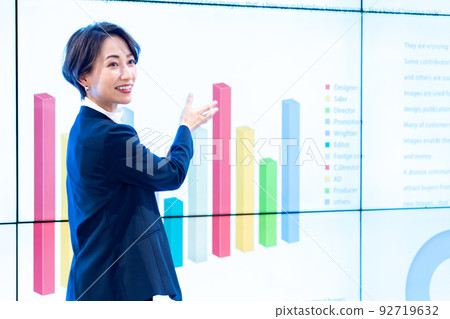 Middle-aged woman giving a presentation 92719632