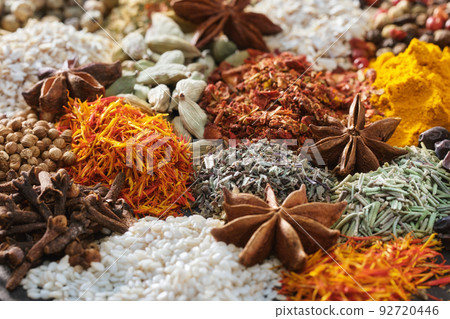 Spices. Aromatic Indian spices on a slate background. Spices and herbs on a stone background. Spices. Aromatic Indian spices on a slate background. Spices and herbs on a stone background. 92720446