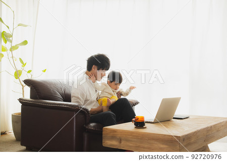 A man by the window 92720976