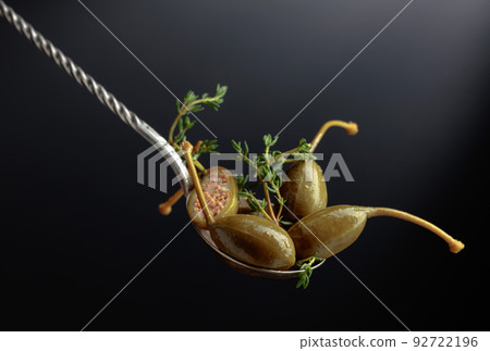 Large pickled capers with thyme. Large pickled capers with thyme. 92722196