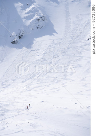 Hikers going through alpine snowy terrain during winter, vertical shot, Slovakia, Europe Hikers going through alpine snowy terrain during winter, vertical shot, Slovakia, Europe 92723096