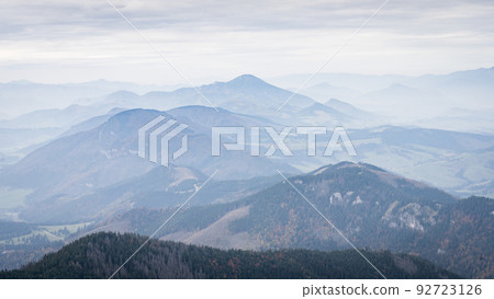 Autumn landscape with forests and mountains disappearing in fog, Slovakia, Europe Autumn landscape with forests and mountains disappearing in fog, Slovakia, Europe 92723126