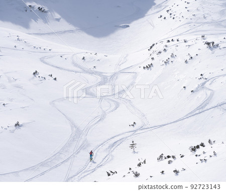 Ski alpinist roaming through alpine valley full of snow, Slovakia, Europe 92723143