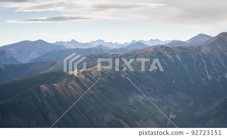 Alpine landscape with mountain ridgelines, peaks and forest in autumn colors, Slovakia, Europe Alpine landscape with mountain ridgelines, peaks and forest in autumn colors, Slovakia, Europe 92723151
