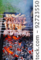 Barbecues on coals are prepared in the summer in the open air 92723550