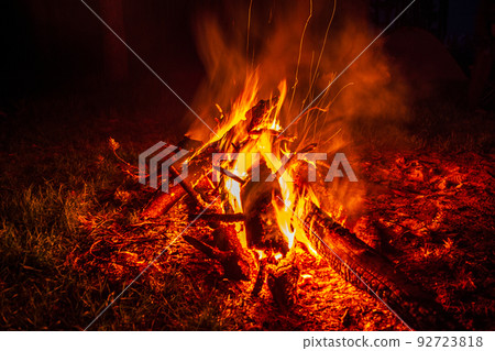 bonfire at night in the forest, sparks from a fire, Night campfire bonfire at night in the forest, sparks from a fire, Night campfire 92723818