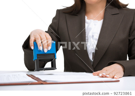 businesswoman Putting Stamp On Documents. isolated white background 92723861