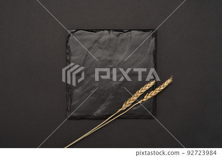 Mockup square Blank black board. black stone board for menu or recipe text. Flat lay with mockup plaque food menu on black table. minimalistic design. space for text 92723984