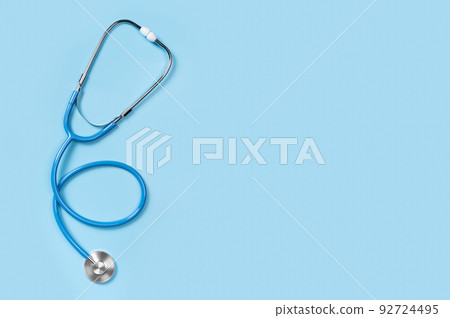 Medical stethoscope isolated on blue background. stethoscope is an important diagnostic tool for doctor. copy space. Flat lay, top view Medical stethoscope isolated on blue background. stethoscope is an important diagnostic tool for doctor. copy space. Flat lay, top view 92724495
