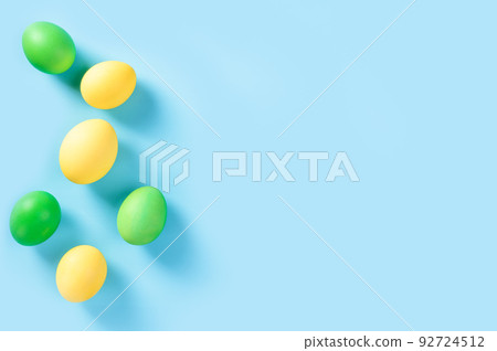 Colorful Easter eggs. flat lay. background of colorful, pastel, hand painted Easter eggs. Pastel Easter eggs on blue background top view. Flat lay style. Colorful Easter eggs. flat lay. background of colorful, pastel, hand painted Easter eggs. Pastel Easter eggs on blue background top view. Flat lay style. 92724512