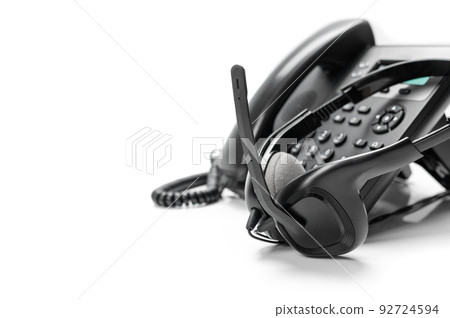 communication technology concept. black ip phone and headset isolated on white background communication technology concept. black ip phone and headset isolated on white background 92724594