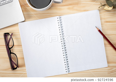 Top view workspace notepad with pencil and blank tablet screen for placing your text and design. Top view office desk mockup 92724596