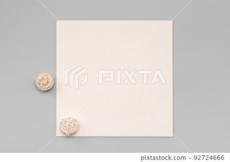 Mockup Of A Square Paper Card With minimal decoration on a neutral color table. minimalistic design 92724666