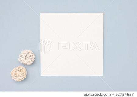 Mockup Of A Square Paper Card With minimal decoration on a pastel color table. minimalistic design 92724687