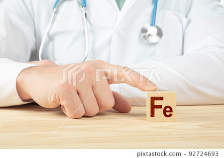 chemical element Fe necessary for human health. essential vitamins and element for humans. Fe alphabet on wood cube. doctor recommends taking Ferrum. doctor talks about the benefits of Ferrum. chemical element Fe necessary for human health. essential vitamins and element for humans. Fe alphabet on wood cube. doctor recommends taking Ferrum. doctor talks about the benefits of Ferrum. 92724693