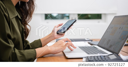 Asian young woman pay for goods digital payment success on smartphone Asian young woman pay for goods digital payment success on smartphone 92725127