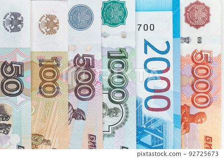 Russian rubles background. Money background and texture. Banknotes of different denominations Russian rubles background. Money background and texture. Banknotes of different denominations 92725673