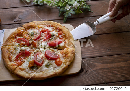 Homemade margherita pizza serving 92726041