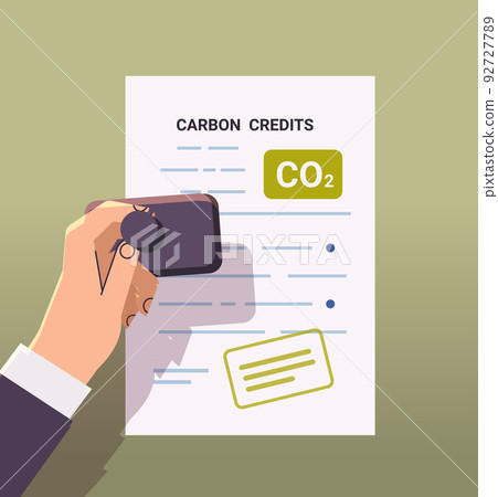 human hand stamping legal document CO2 limit emissions idea net zero emission carbon credit offset concept 92727789