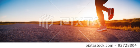 Woman running outdoors on the evening sunset. Woman running outdoors on the evening sunset. 92728804